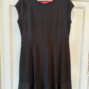 LOFT black dress size 14. Back zip with cute fluttery ruffle detail at hem.NWT